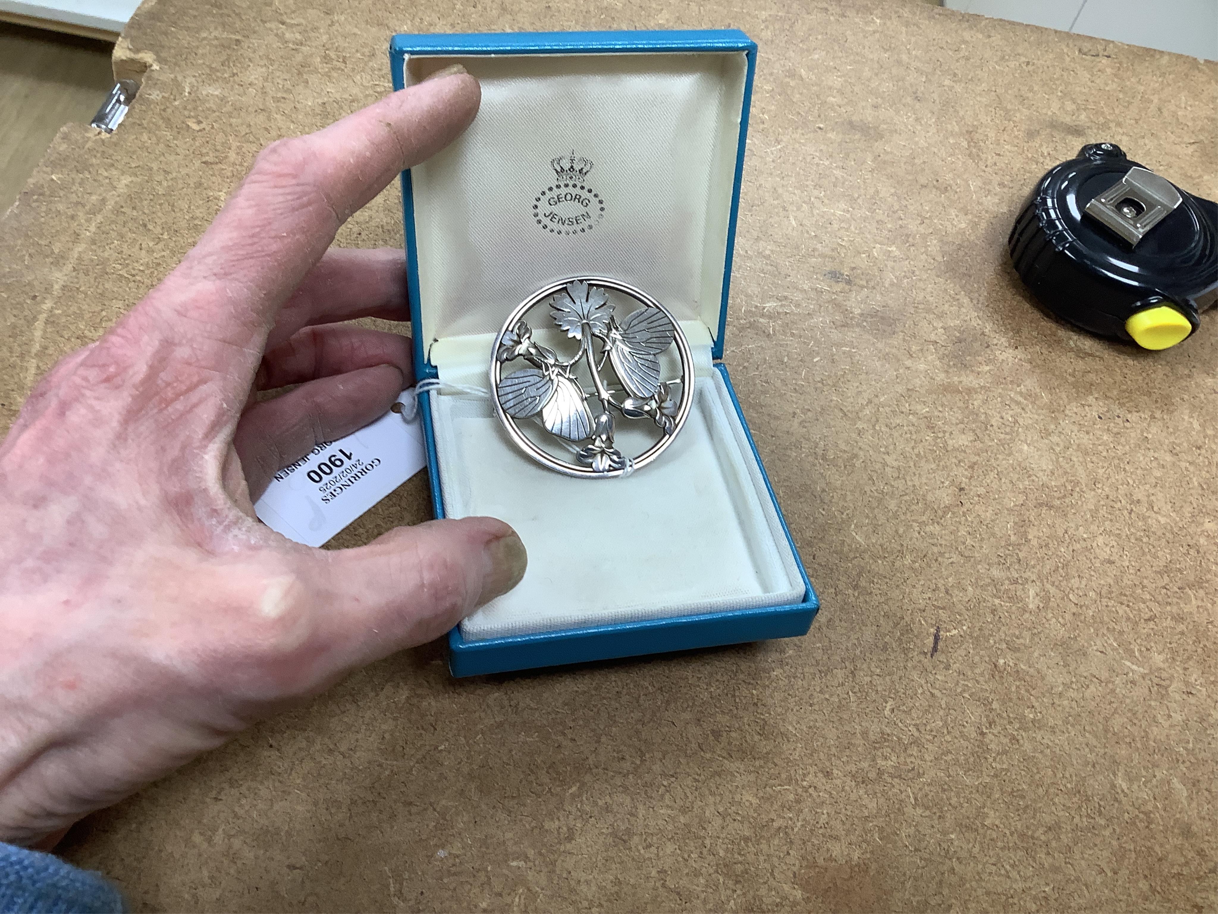 A Georg Jensen sterling moth and leaf circular brooch, design no. 283, 55mm, with Georg Jensen box. Condition - fair to good